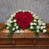 Signify your love with our red rose heart casket spray. This casket