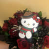 12 RED ROSES WITH SPRAY PAINTED BABY BREATH AND RUSCUS IN BLACK.