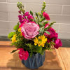 A vibrant mix of cool lavender and Pink Floyd roses. crowned with