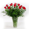 Dozen red roses in a clear container 