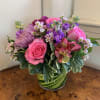 Pink roses, medium purple stock, purple pom buttons, hot pink alstromeria, and