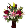 Designed with Roses, Pink Stargazer, Baby Breath, and greenery.  