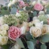 The interplay of pink and white/ivory in this formal bouquet creates a
