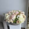 This beautiful arrangement filled with the roses, hydrangeas, peonies and greens to