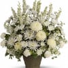 This magnificent bouquet of classic all-white flowers in a graceful Grecian urn