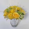 Simplicity is key. This elegant flower arrangement in a vase features the