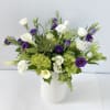 This arrangement is presented in 4&quot;w*8&quot; tall white ceramic vase. It features
