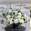 A black and white floral arrangement can be quite striking and elegant.