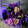 This stunning bouquet is a celebration of elegance and charm, featuring a