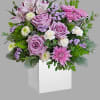 Experience the enchantment of blooms delivered! Purple roses in a eco-friendly wooden
