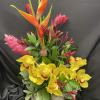 This bright tropical arrangement is sure to drive away any winter blues!