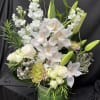 This bright white arrangement will brighten any space, it is made with