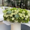 Spring box with green garden roses ,succulents and greenery