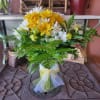 What could be sweeter than a cheerful glass vase filled with white