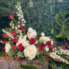 Beautiful funeral piece with red, white roses