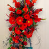 Crimson Embrace

A poignant tribute of vibrant reds, this standing spray, artfully arranged
