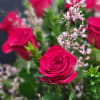Glass vase will display a burst of exquisite pink roses sure to
