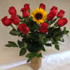This arrangement comes complete with a dozen red roses surrounding one single