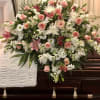 Pink roses, pink lilies, white stock, white spider mums, white daisies and