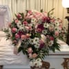 Pink lilies, pink roses, hot pink gerberas, pink carnations, pink lisianthus, white