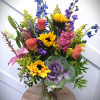 This arrangement is a bright mix of flowers hand picked from our