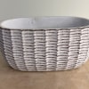 A ceramic basket is used as the base of this arrangement. The
