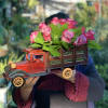 Dozen Seasonal Roses in a wooden truck model