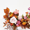 - Captures essence of autumn with rich, warm tones
- Seasonal blooms evoke