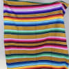 - OFF-WHITE WOVEN TOTE
- DESERT CLAY TONED FLORAL ARRANGEMENT
- CREAM SOMBRERO
- SERAPE