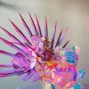  - Radiates vibrant energy with neon floral arrangement
- Features bright purple
