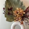 - Embodies cozy essence of autumn
- Adorned in warm, dark hues reminiscent