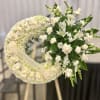 This elegant funeral wreath is a beautiful tribute to honor a loved