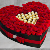 A modern flower arrangement in a heart box filled with roses &amp;
