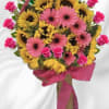 Surprise them with a beautiful bouquet of pink gerberas and yellow sunflowers.
They&#039;ll