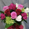 This arrangement is designed with over a dozen roses Red Roses, Pink