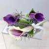Orchid or rose corsages include seasonal greens, and a ribbon in the