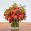 Beautiful fall floral arrangement with fall colors made with roses, mini calla