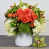 This Cutie Pie floral design comes in a marble vase, with white