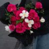 The product contains pink roses, tulips, green leaves paired and is packaged