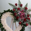 Open heart with white carnations, red roses, and purple lilies.