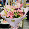 This beautiful bouquet contains all kinds of pink and purple flowers that