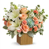 Reminiscent of a desert sunrise, this modern mix of peach blooms, white