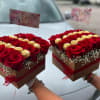 Combining a bouquet of roses and chocolates is a lovely way to