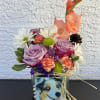 Cans full of love decorated with fresh seasonal flowers.

We personalize your floral