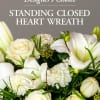 Send a sympathy floral standing closed heart created by one of our