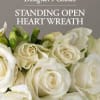 Send a sympathy floral standing open heart wreath created by one of