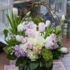 A stunning arrangement with Hydrangeas, tulips, roses, lilies and more
