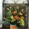 Medium sized arrangement with tropical flowers and fall touch 