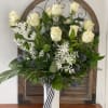 Tall steam of white dozen roses in ceramic vase in combinations with