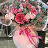 Roses: The bouquet includes an assortment of specialty roses in different shades